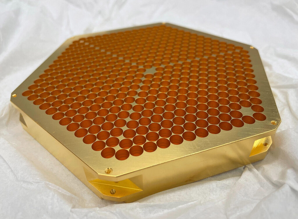 Fig. 3: A recently completed LAT-MF feed-horn array after the final gold-plating step.